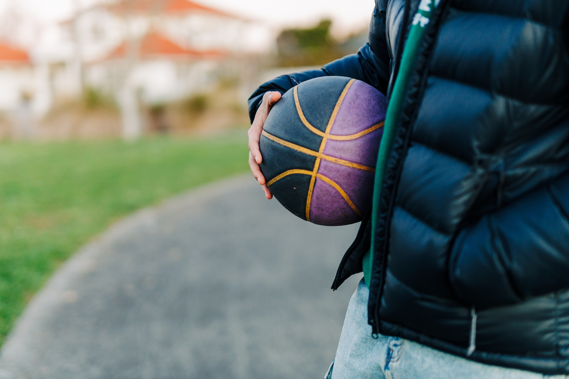 Close up of someone holding a basketball