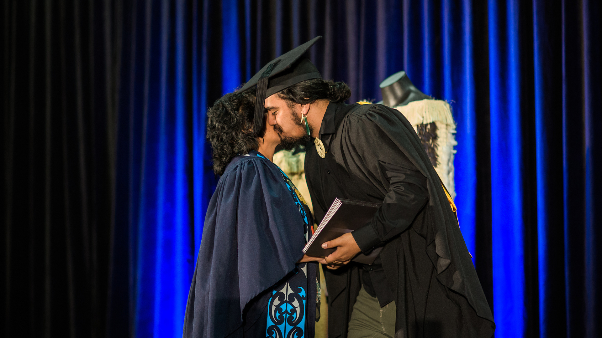 A student receives their qualification during graduation