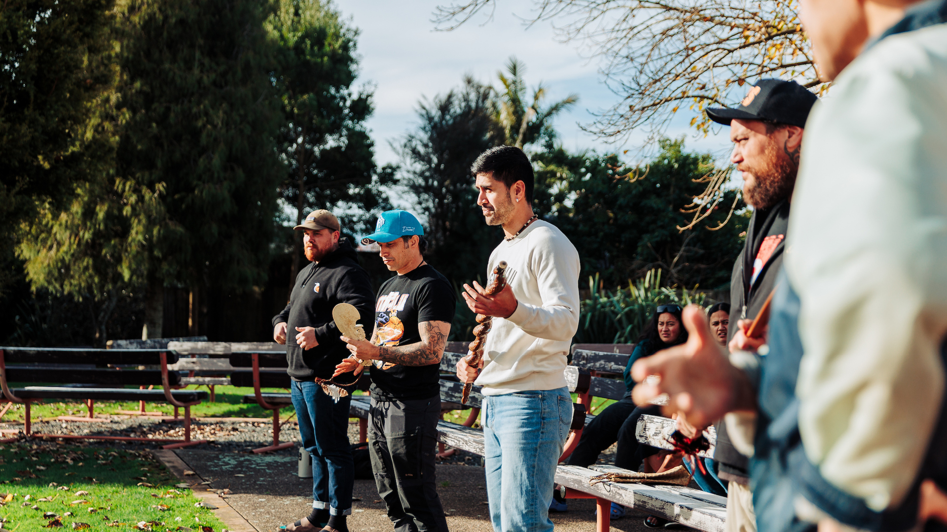 Men whaikōrero during pōwhiri proceedings