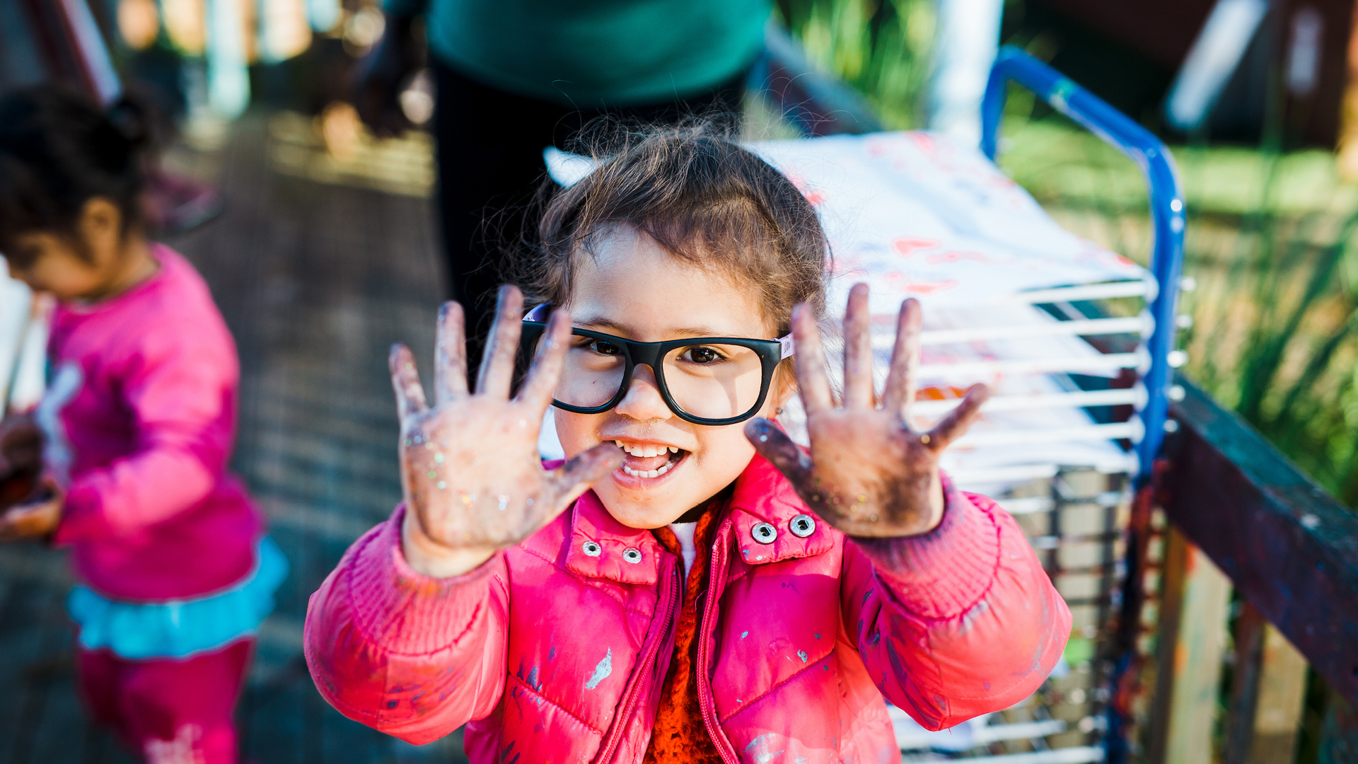Happy child with painted hands