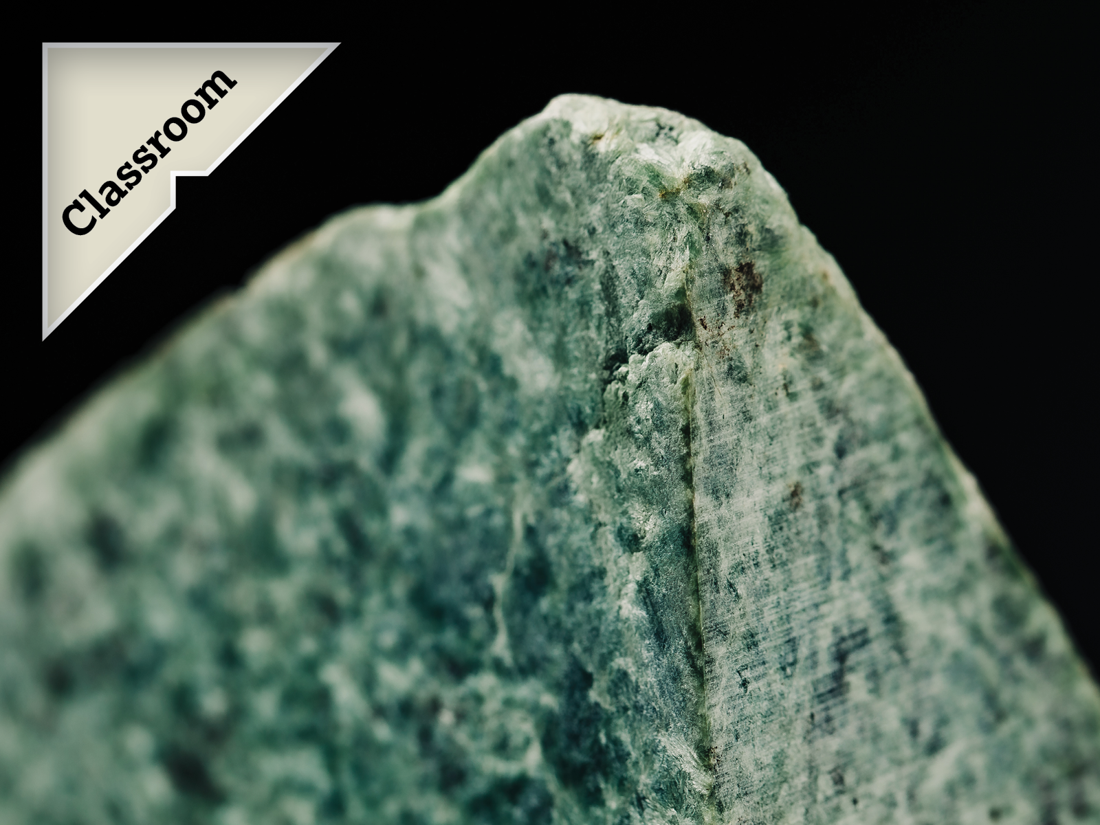 A photo of raw pounamu with a callout badge saying 'Classroom'