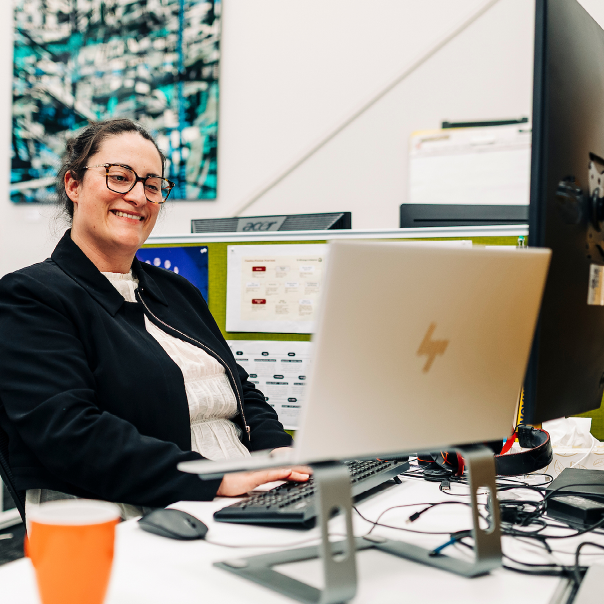 Woman studying on laptop at desk