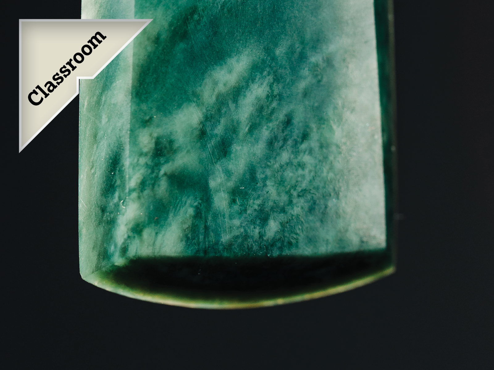 Close up of a pounamu toki with a callout badge saying 'Classroom'