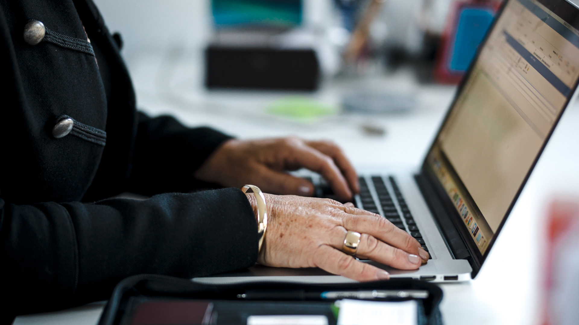 Close up of a woman's hands using a laptop