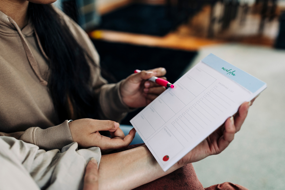 A woman writes down a plan