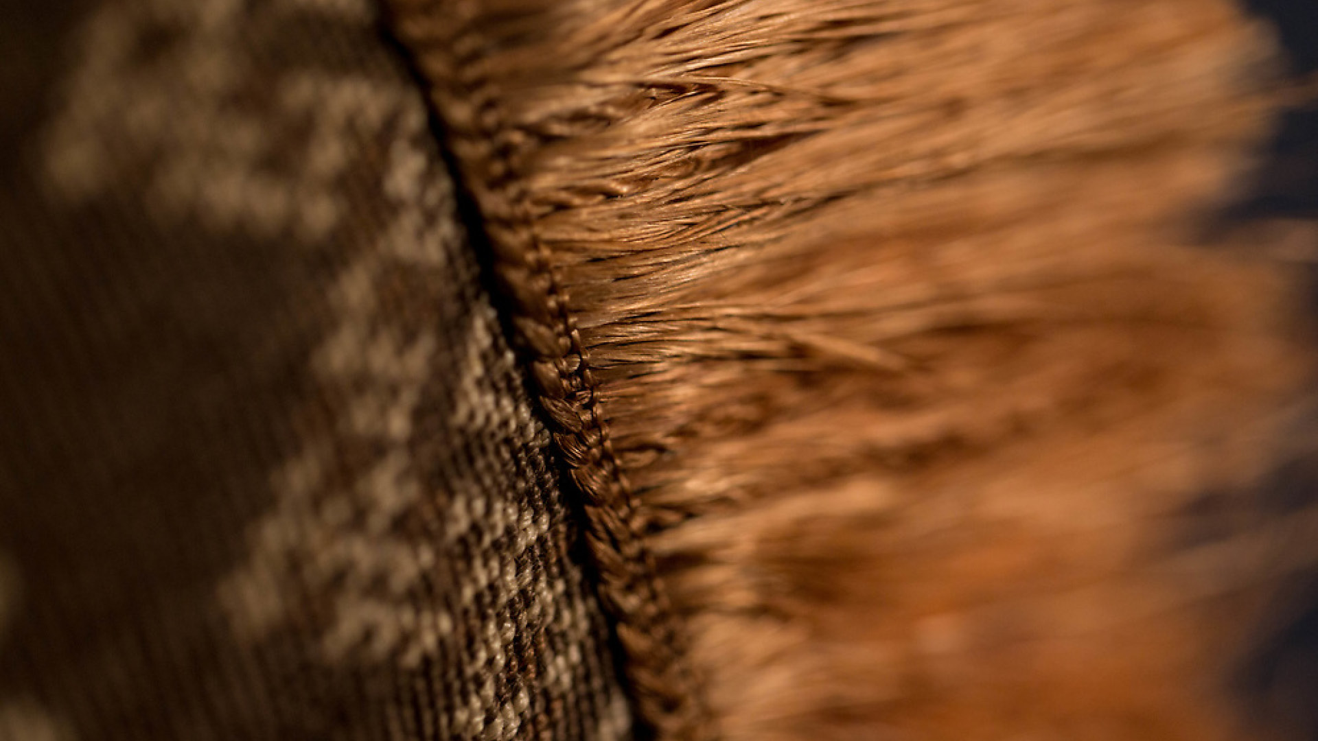 a close up photo of natural flax fibres woven into fabric using Māori weaving techniques