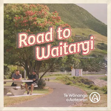 Road to Waitangi text above two people sitting at a picnic table